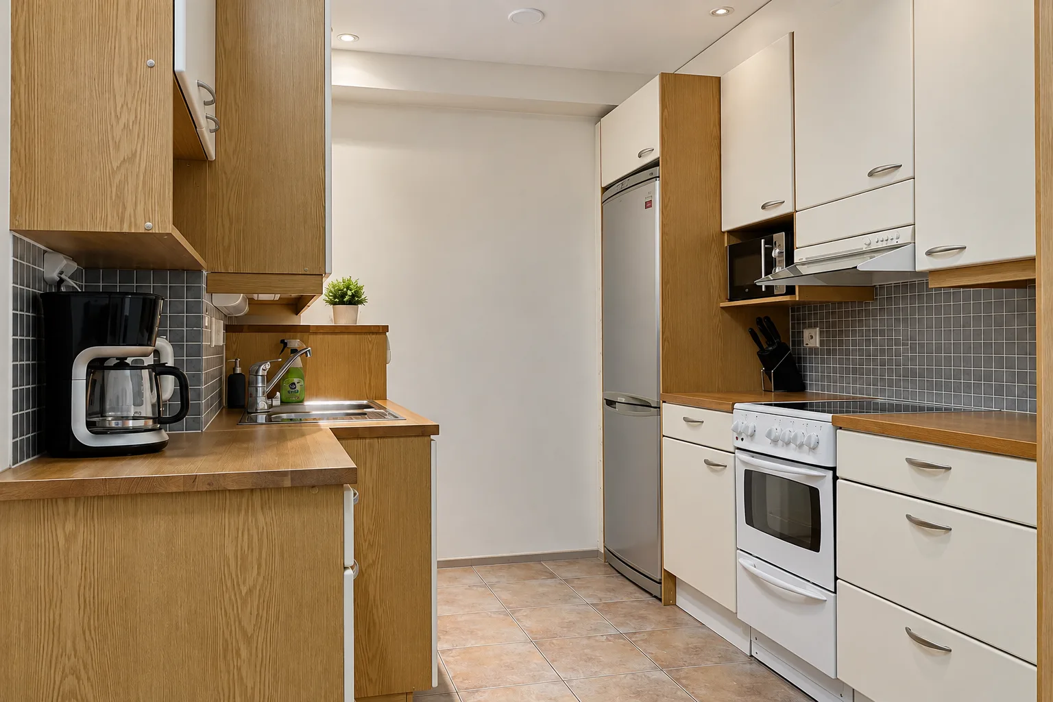Kitchen with a stove and refrigerator