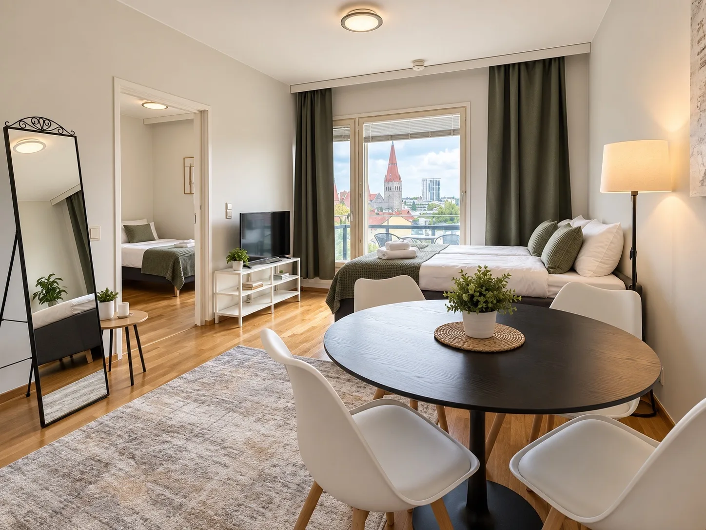 Bed, dining table and kitchen in one space